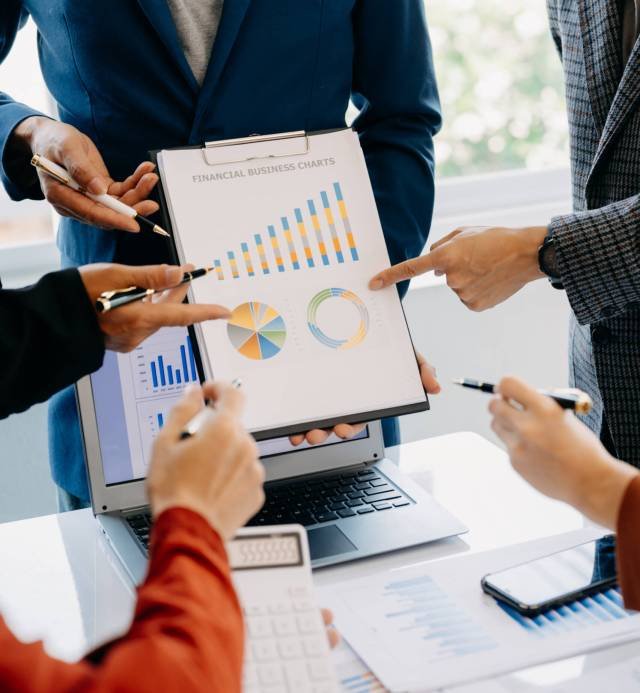 Business team meeting present.professional investor working with  Finance managers task. with laptop smart phone and digital tablet in morning light